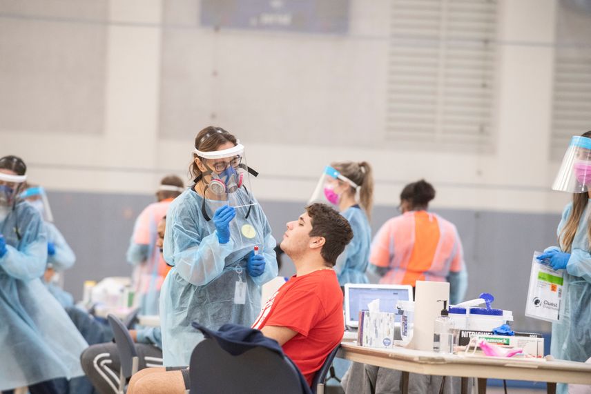 A WVU School of Nursing student administers a COVID-19 test to a WVU student.