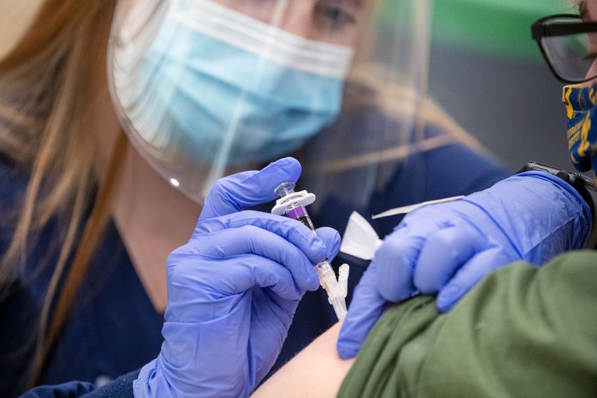 A WVU student is administered a flu shot.