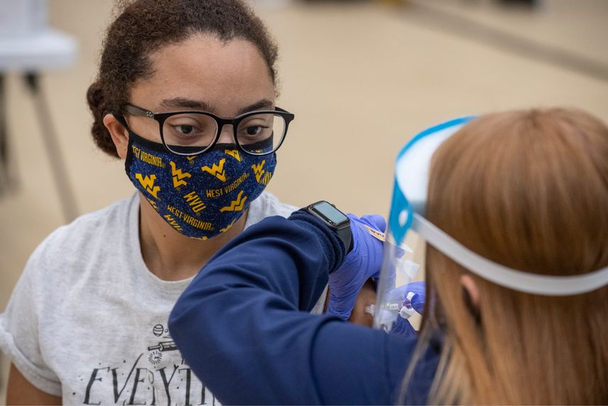 A WVU student receives a flu shot.