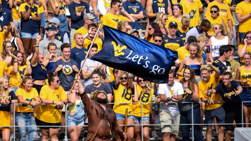 The student section cheering on the Mountaineers at a WVU football game in 2019.