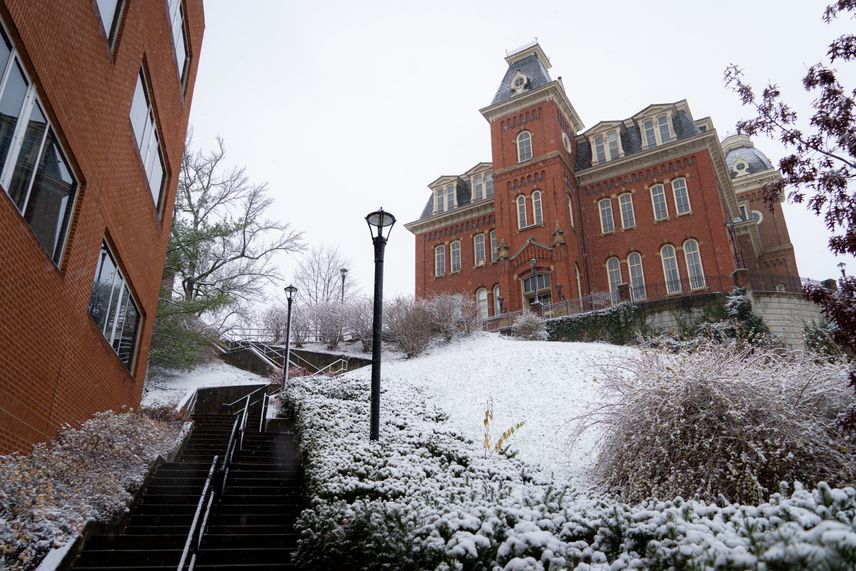 A snowy trek up the Life Sciences stairs to Woodburn Hall.